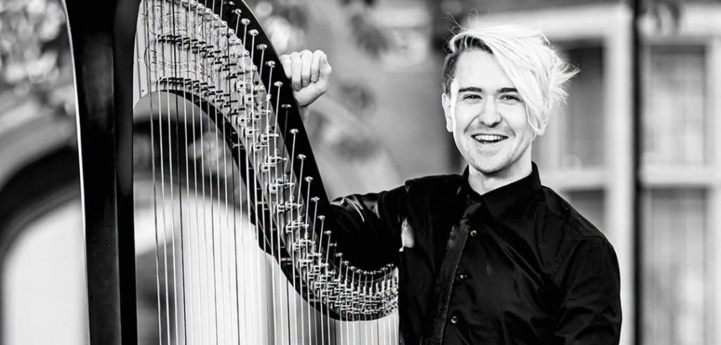 Richard_Allen_BBC_Phil A black-and-white image of Richard Allen standing with his harp