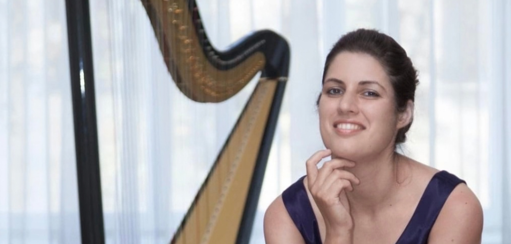 Veronika_Lemishenko_RBC Veronika Lemishenko smiles with her harp in the background